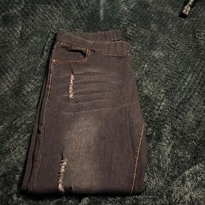 XL denim elastic waist jeggins with lite distressing on legs.